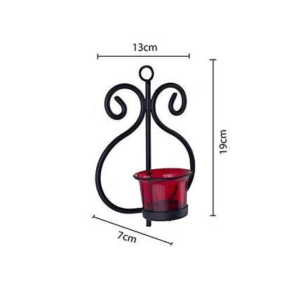 Stylish black metal candle holder with eye-catching red glass, a chic addition to your home decor.