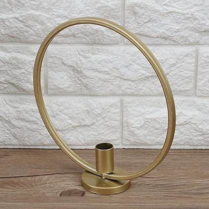 Two gold candle holders featuring a bear.