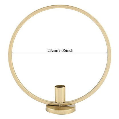 Pair of gold candle holders adorned with bear design.