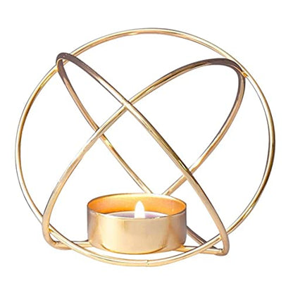 A gold metal tealight holder with a purple candle, creating a warm and cozy ambiance. Perfect for adding a touch of elegance to any space.