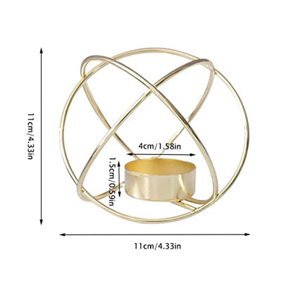 Elegant gold metal tealight holder with purple candle glowing.