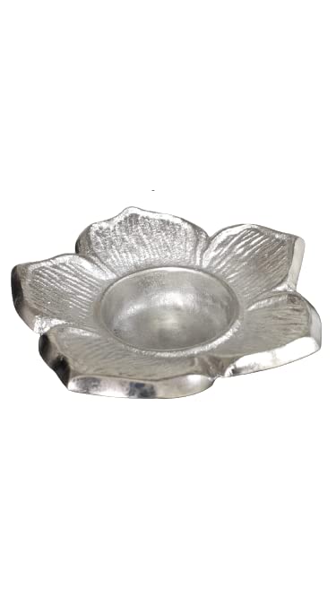 A silver flower-shaped dish on a white background.