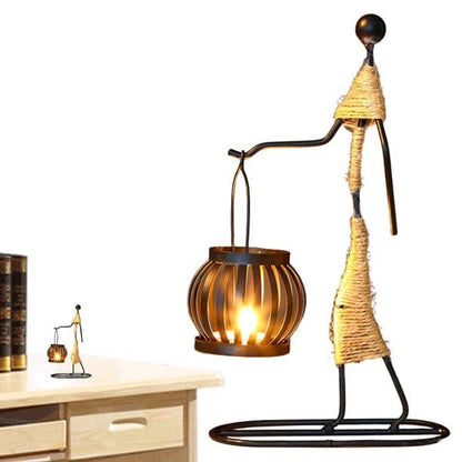  Metal sculpture with candle and flower