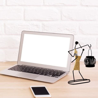 Woman-shaped metal sculpture with basket, detailed design, graceful and artistic.