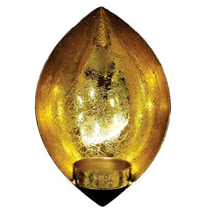 Gold leaf design candle holder with black base.