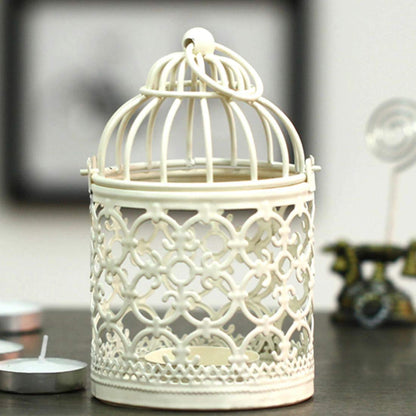 Bird cage with a flickering candle inside.