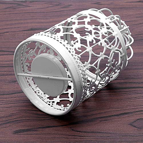 A small candle glowing inside a bird cage.