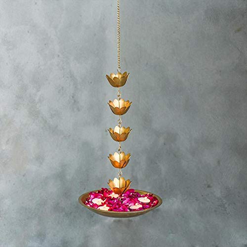 A beautiful hanging flower pot adorned with colorful flowers and candles, creating a serene and enchanting ambiance.