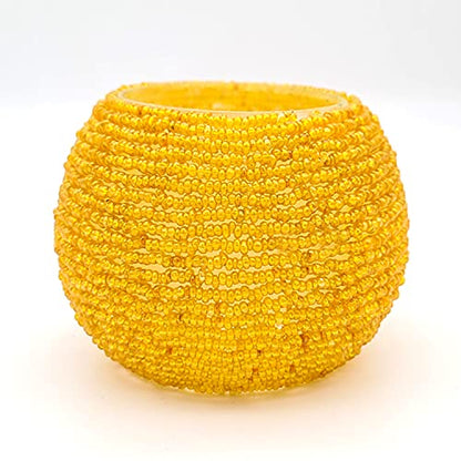  Bright yellow ball with beads on white