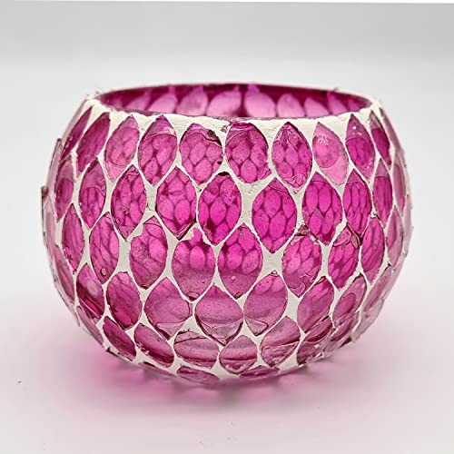  Glass candle holder with glowing flame.