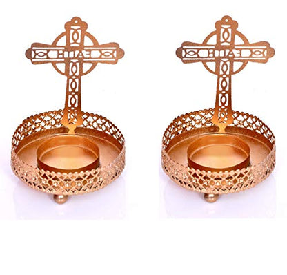 Decorative gold candle holders in cross shape, a lovely symbol of faith and devotion.