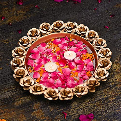 Gold plate with red flowers and intricate gold designs.
