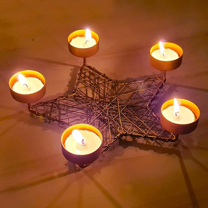 A decorative star candle holder with four candles, adding a touch of elegance to any room.
