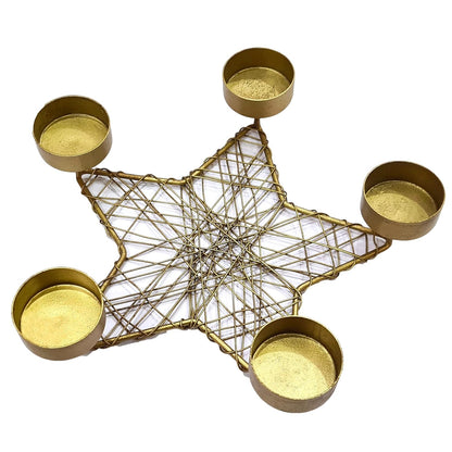 Five candles flickering in a star-shaped holder, providing a peaceful and inviting atmosphere.