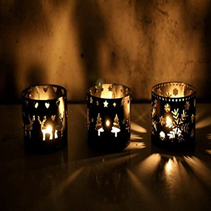 Three gold tea lights with Christmas designs, adding a festive touch to any holiday decor.