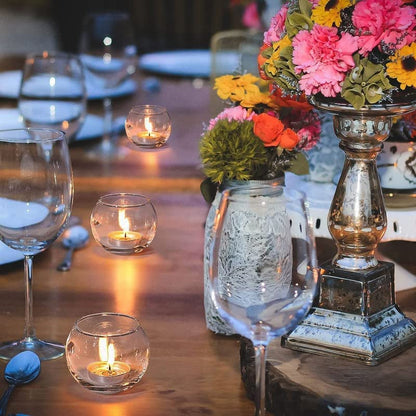  Lit candle in a glass bowl, providing a soft, comforting light.