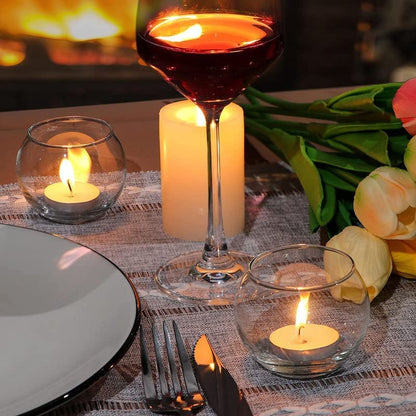 A candle flickering inside a glass bowl, creating a cozy ambiance.