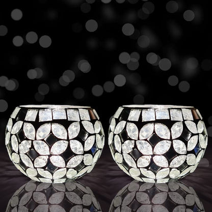 Elegant tealight holders on a sleek black surface