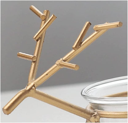 Decorative gold reindeer candle holder with a burning candle, adding warmth and charm to any room.