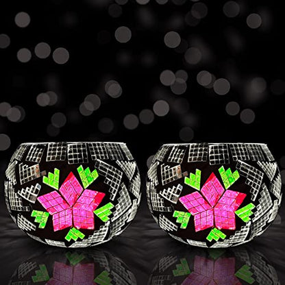 Two glass bowls with pink and green designs, one with floral patterns and the other with geometric shapes.