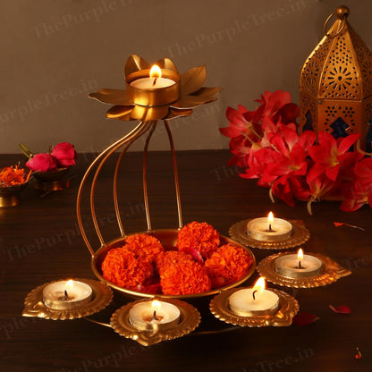 Beautiful gold candle holder featuring delicate flowers and flickering candles for a cozy atmosphere.