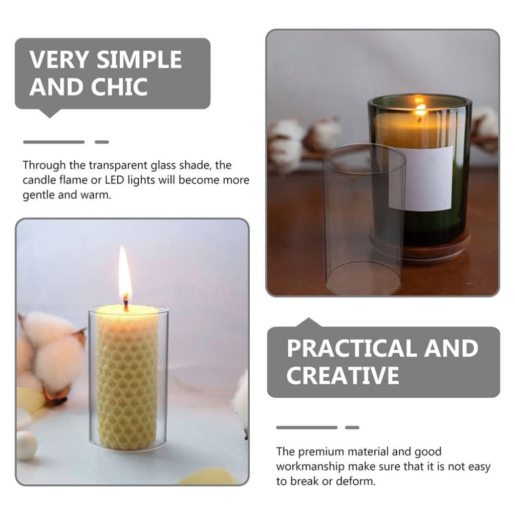 Glass candles with white flowers in the backdrop.