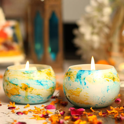 Decorative candles in yellow and blue patterns, ideal for creating a warm and inviting atmosphere.