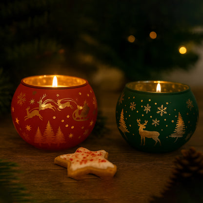 Two lit candles in decorative holders with Christmas patterns, surrounded by a festive atmosphere.