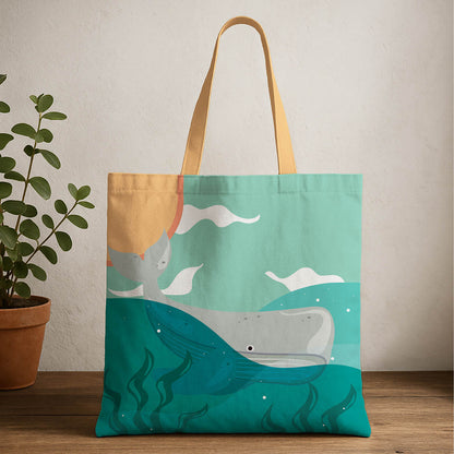 A tote bag featuring a whale design with a sun in the background, showcasing a playful ocean theme.