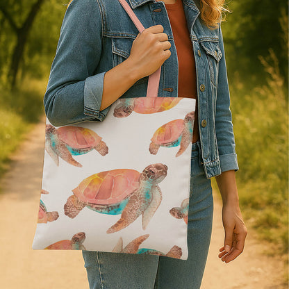 A stylish tote bag adorned with a vibrant watercolor turtle design.