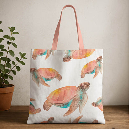 A tote bag featuring a colorful watercolor print of a turtle on a light background.