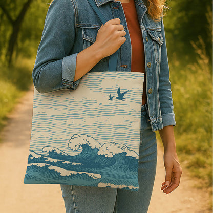 A tote bag design showcasing a bird flying gracefully over ocean waves, evoking a sense of freedom