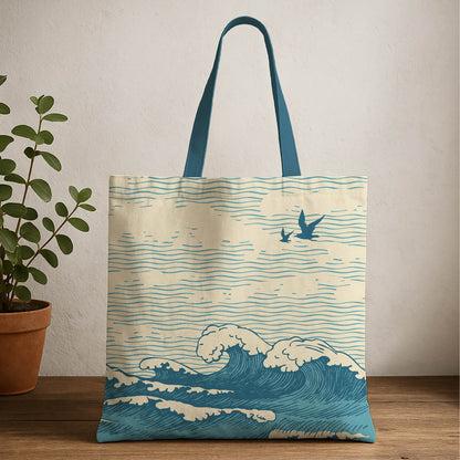 A tote bag featuring a bird soaring above stylized waves, capturing a serene coastal scene.