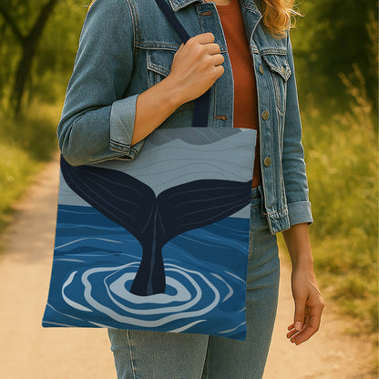 A tote bag with a whale tail design, prominently displaying a blue whale, perfect for ocean lovers and eco-conscious shoppers.