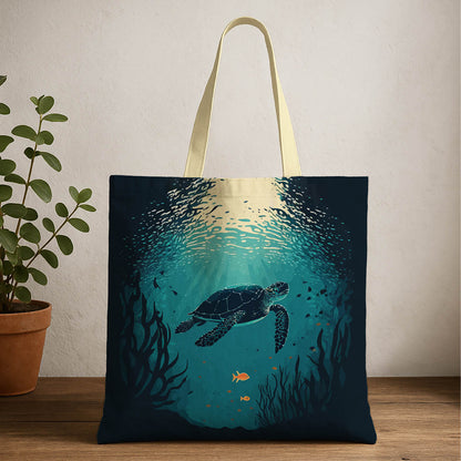 A tote bag featuring a sea turtle gracefully swimming in the ocean, showcasing vibrant colors and marine life.