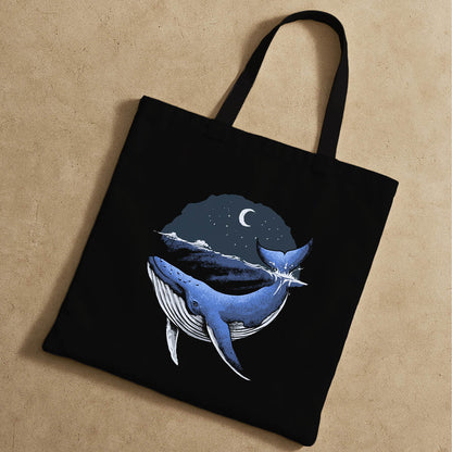 Tote bag design with a blue whale in the ocean, highlighting the beauty of marine wildlife.