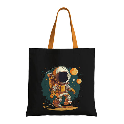A whimsical tote bag featuring a cartoon astronaut, perfect for space enthusiasts and casual outings.