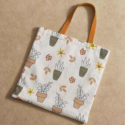 A decorative tote bag displaying a mix of lush plants and blooming flowers, ideal for nature enthusiasts.
