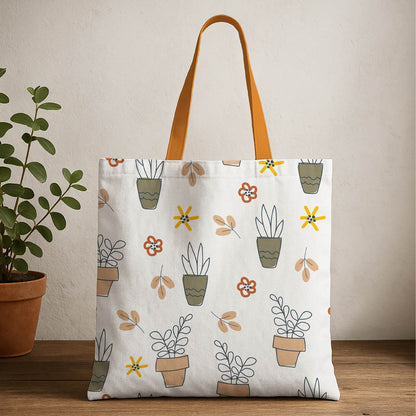 A tote bag adorned with various plants and colorful flowers, showcasing a vibrant and natural design.