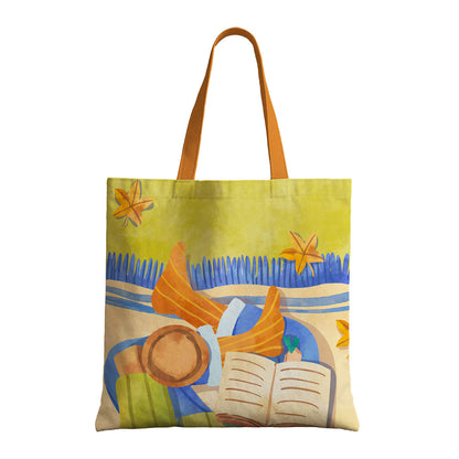 A tote bag with an artistic depiction of a woman reading a book.