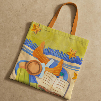 A tote bag showcasing a woman deeply focused on her book.