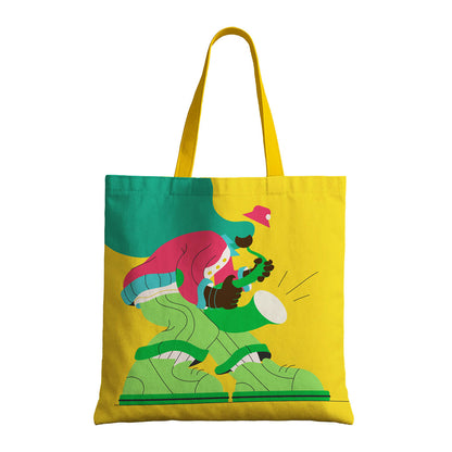 Yellow tote bag displaying a whimsical cartoon character, perfect for casual use or as a gift.