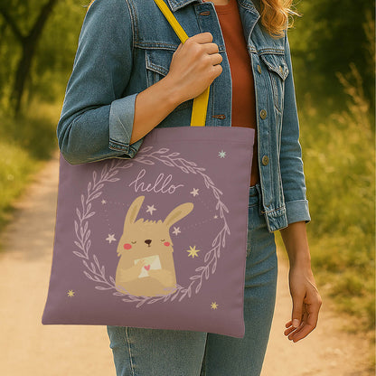 A tote bag adorned with a bunny graphic and the cheerful greeting "hello."