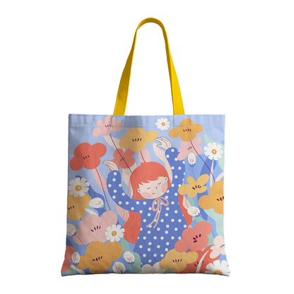 A tote bag adorned with an image of a girl and flowers, capturing a whimsical and nature-inspired look.