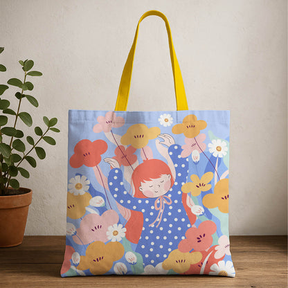 A tote bag featuring a girl surrounded by colorful flowers, showcasing a vibrant and cheerful design.