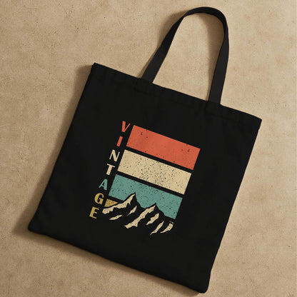 Classic mountain-themed tote bag with a retro design, suitable for eco-friendly shopping or outdoor adventures.