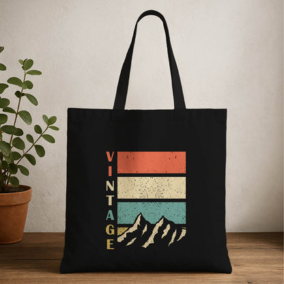 Vintage mountain tote bag featuring a scenic landscape design with mountains , perfect for outdoor enthusiasts.