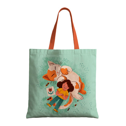A tote bag featuring a girl and a cat, highlighting a delightful and playful artistic theme