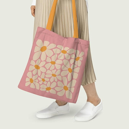 A pink tote bag accented with flowers design and yellow handles, designed for practicality and style.