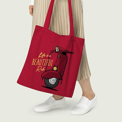 A stylish red tote bag with a scooter graphic on the front.